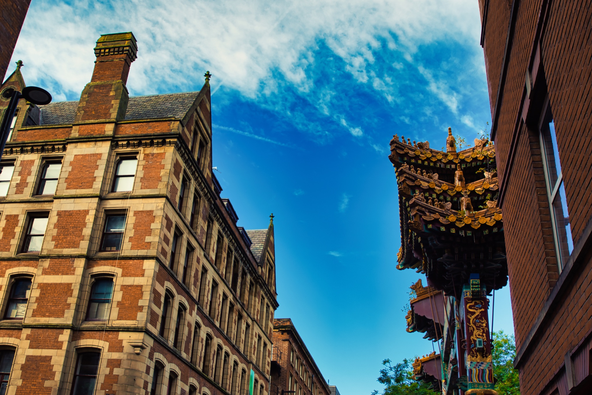 Brick Building with Ornate Roof Structure in Manchester, UK.